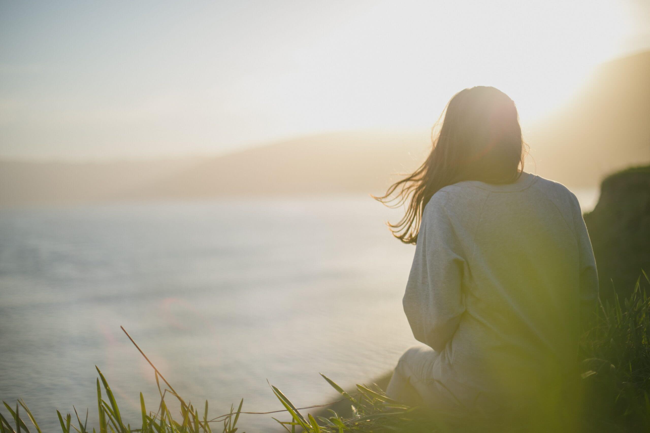 woman on beach at sunrise