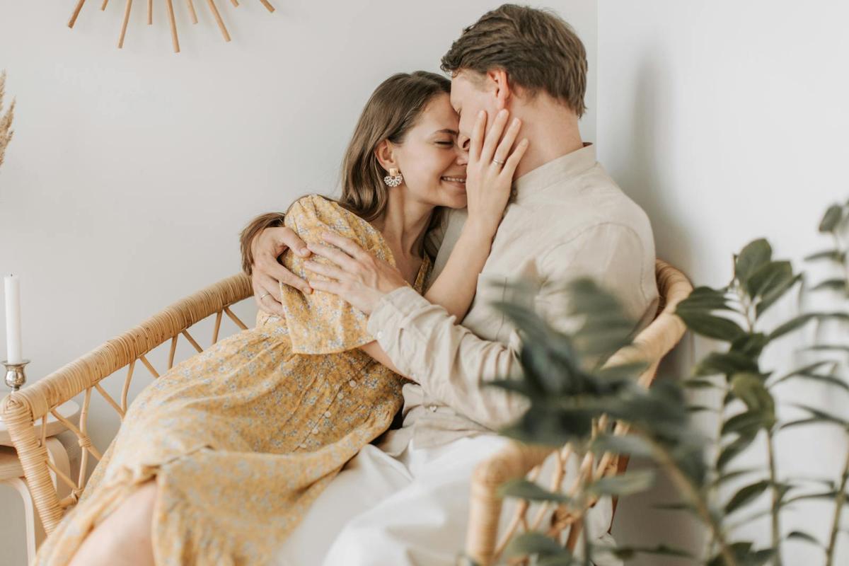 Affectionate couple embracing in soft natural light, symbolizing emotional safety, trust, and secure attachment in therapy with an Encino and Los Angeles attachment therapist.