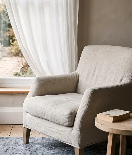 A chair positioned next to a small table